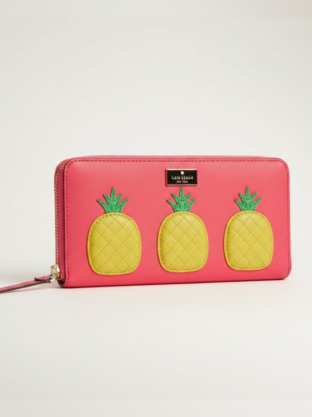 Kate Spade "How Refreshing" Pineapple Neda Wallet in the color "Pink Bonnet."